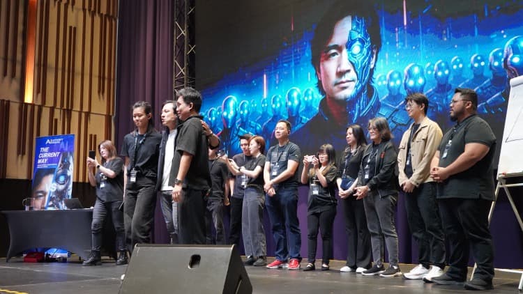 Thomas speaking at a live event